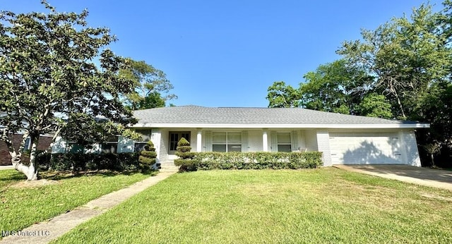 view of front of property with covered porch, a garage, a front lawn, concrete driveway, and brick siding