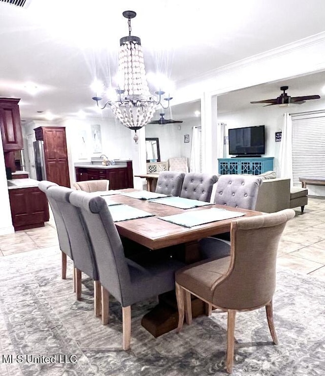 dining room featuring ornamental molding, visible vents, and ceiling fan with notable chandelier