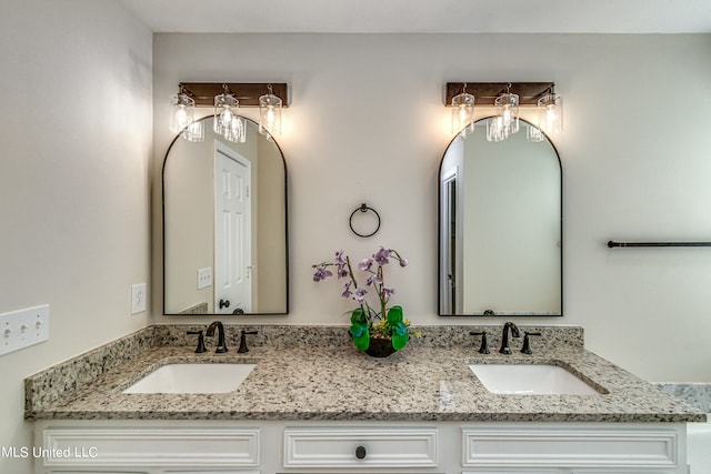 bathroom featuring vanity and ceiling fan