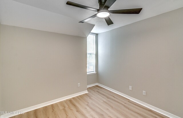 empty room with ceiling fan and light wood-type flooring