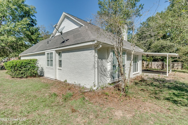 view of side of home featuring a lawn