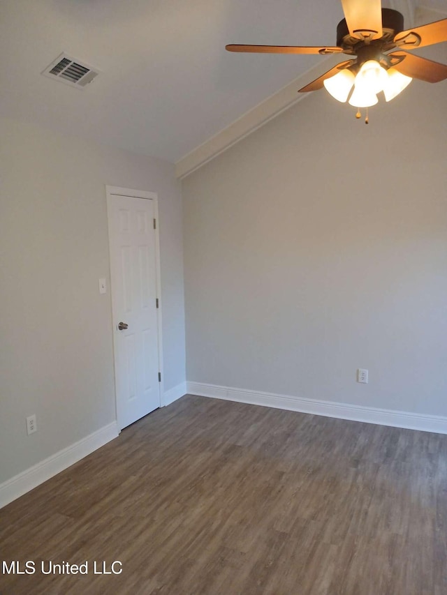 empty room featuring ceiling fan and dark hardwood / wood-style floors