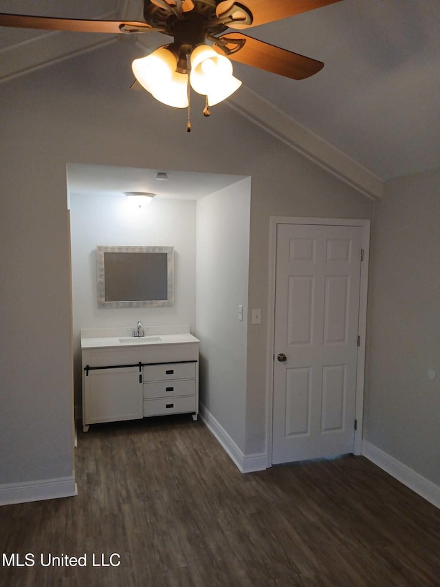 bathroom featuring vanity, hardwood / wood-style flooring, lofted ceiling, and ceiling fan