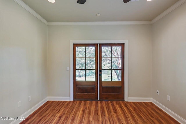 doorway featuring crown molding, dark hardwood / wood-style floors, and ceiling fan