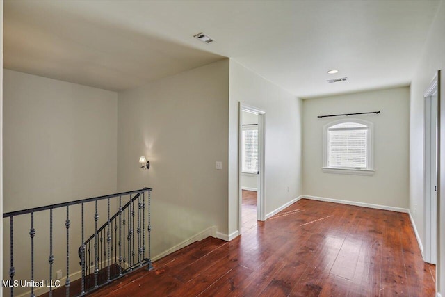 entryway with dark hardwood / wood-style flooring