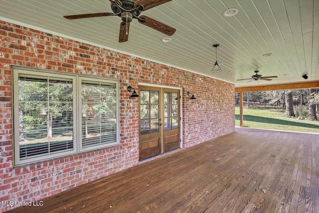 wooden terrace featuring ceiling fan