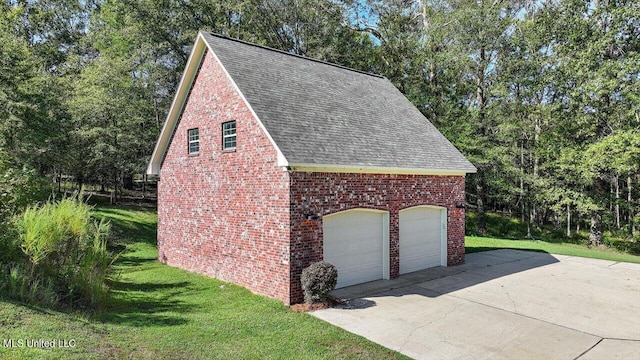 garage with a yard