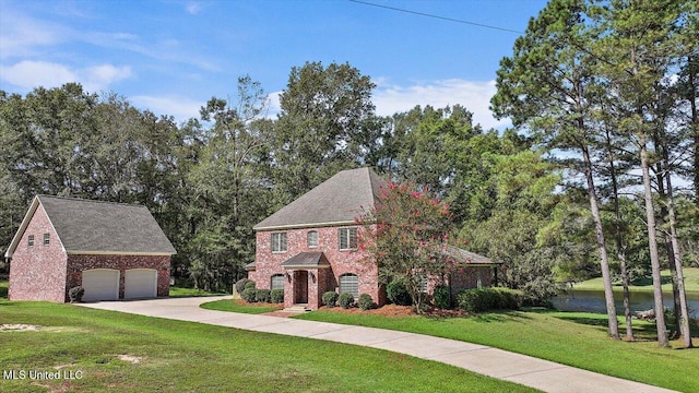 view of front of property with a front yard and a garage