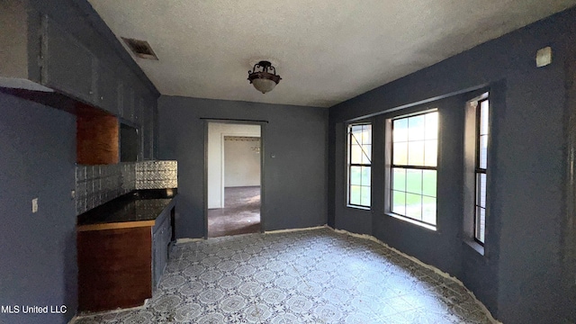 kitchen featuring a textured ceiling