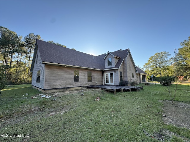 view of property exterior with a lawn and a wooden deck