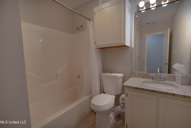 full bathroom with shower / bathtub combination with curtain, vanity, and toilet