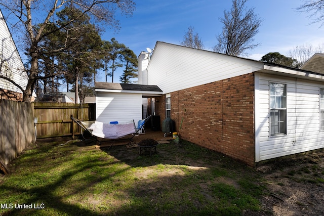 view of side of home featuring a yard