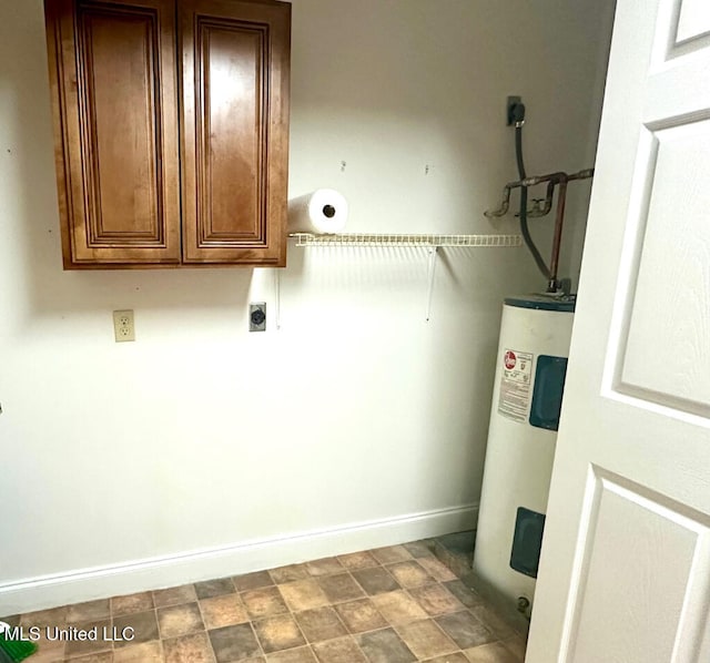 6 Dogwood Cir, Diamondhead, MS 39525 - laundry area with cabinet space, electric dryer hookup, electric water heater, and baseboards