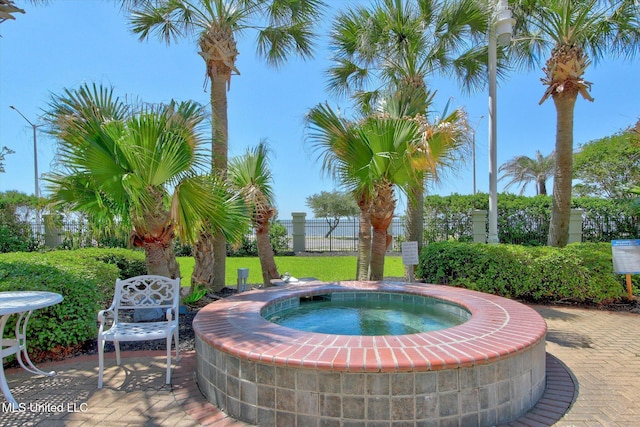 2668 Beach Blvd Unit 1405, Biloxi, MS 39531 - view of swimming pool featuring a hot tub, fence, and a patio area