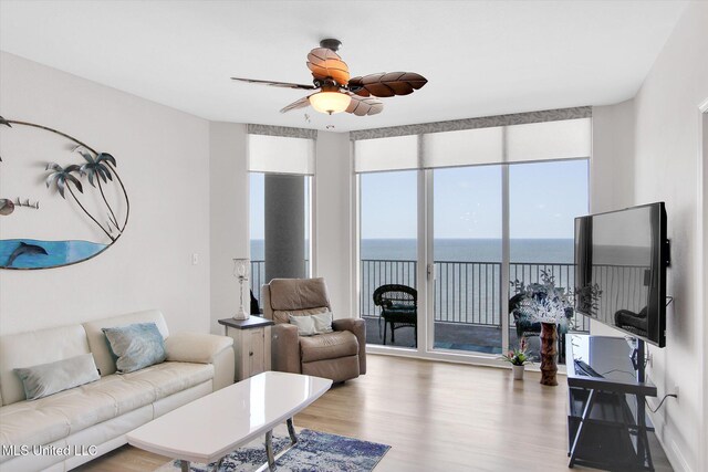 2668 Beach Blvd Unit 1405, Biloxi, MS 39531 - living area featuring light wood-type flooring and a ceiling fan