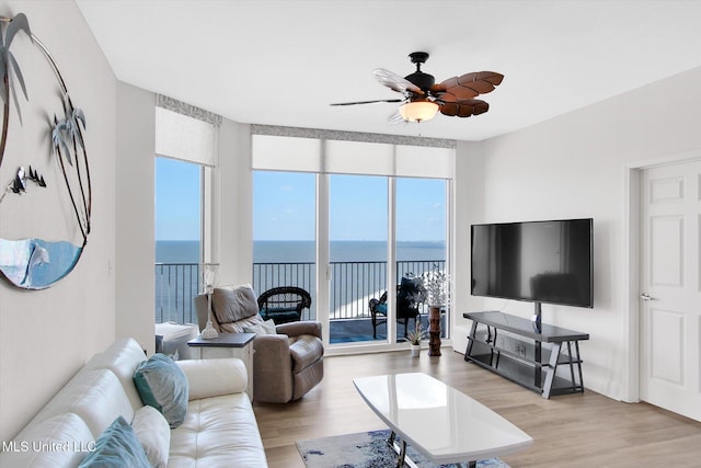 2668 Beach Blvd Unit 1405, Biloxi, MS 39531 - living room featuring a ceiling fan and light wood finished floors
