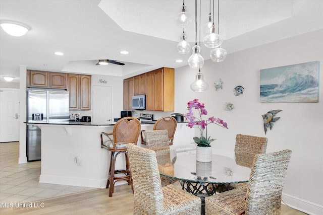 2668 Beach Blvd Unit 1405, Biloxi, MS 39531 - dining area featuring a raised ceiling, baseboards, and recessed lighting