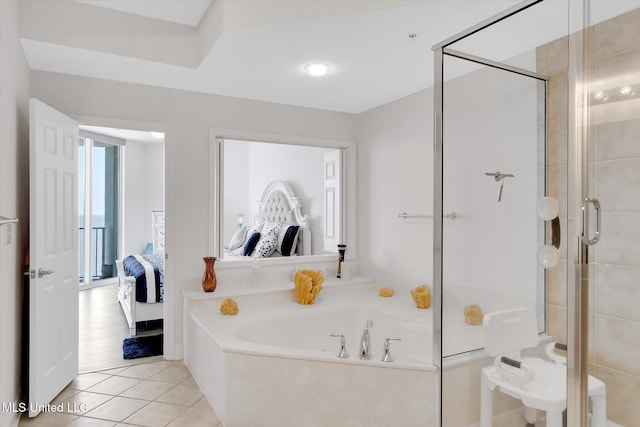 2668 Beach Blvd Unit 1405, Biloxi, MS 39531 - full bath featuring ensuite bath, a stall shower, a garden tub, and tile patterned flooring