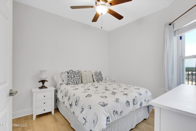 2668 Beach Blvd Unit 1405, Biloxi, MS 39531 - bedroom featuring light wood-style flooring, multiple windows, and a ceiling fan