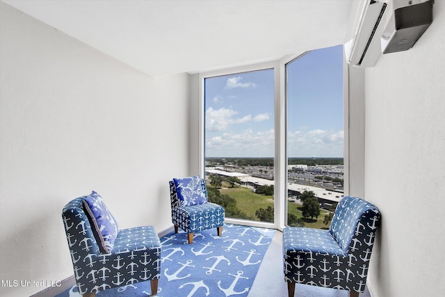 2668 Beach Blvd Unit 1405, Biloxi, MS 39531 - sitting room with expansive windows and a wall mounted AC