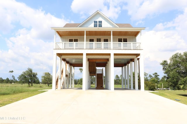 0 N Daytona Dr, Pearlington, MS 39572 - coastal home with driveway, stairs, and a carport