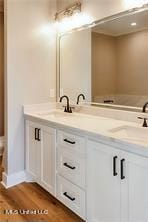 0 N Daytona Dr, Pearlington, MS 39572 - bathroom featuring double vanity and wood finished floors