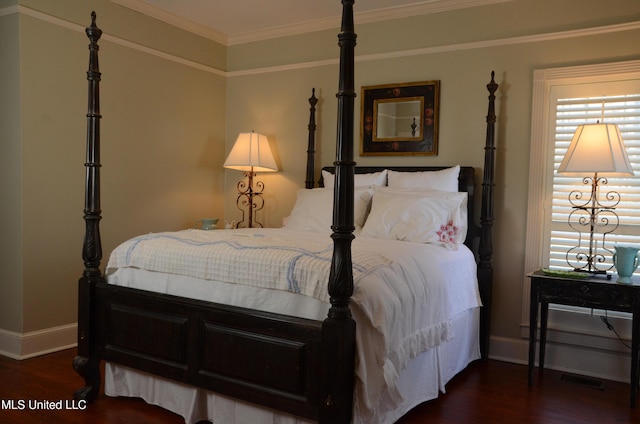 bedroom with baseboards, visible vents, ornamental molding, and dark wood-type flooring