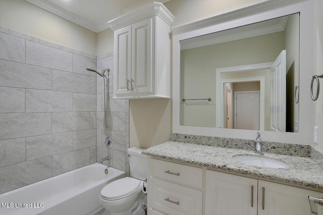 full bathroom with vanity, tiled shower / bath, toilet, and crown molding