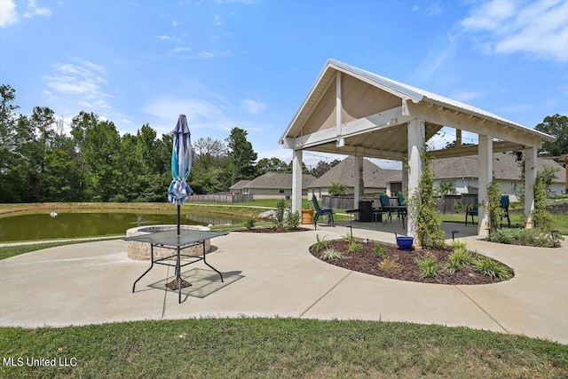 surrounding community with a gazebo and a water view