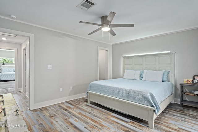 4113 Blue Jay St, Bay Saint Louis, MS 39520 - bedroom with ornamental molding, hardwood / wood-style floors, and ceiling fan