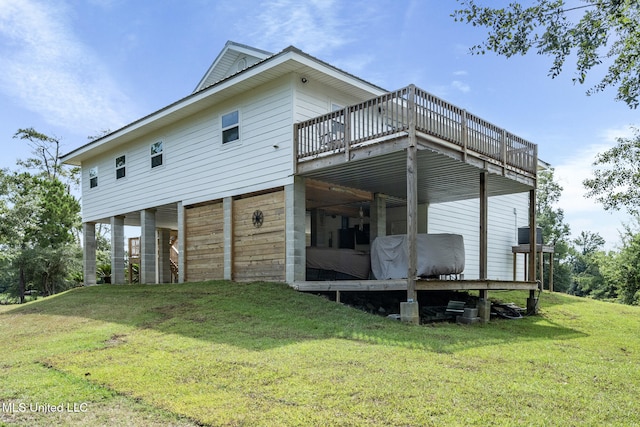 4113 Blue Jay St, Bay Saint Louis, MS 39520 - view of property exterior featuring a wooden deck and a lawn