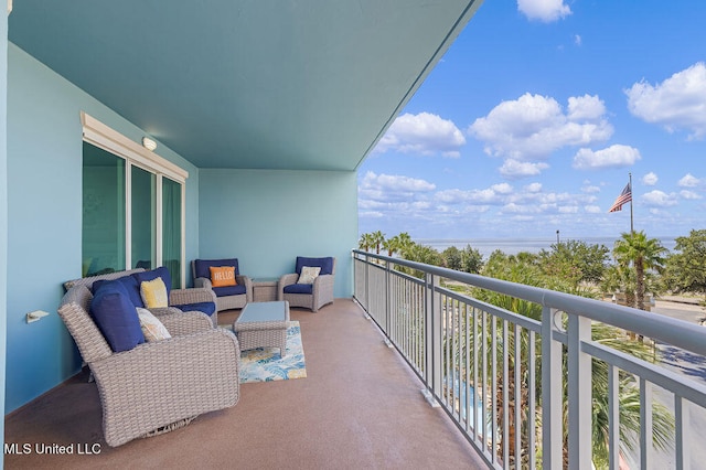 balcony featuring a water view