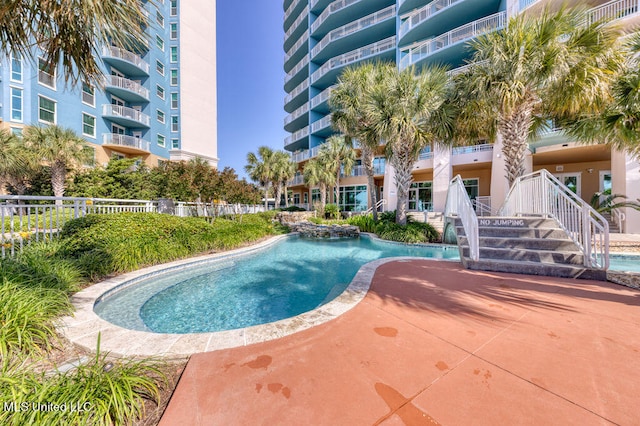 view of swimming pool featuring pool water feature