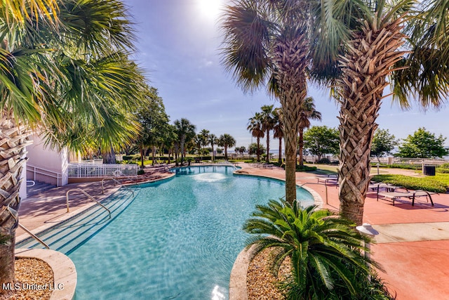 view of swimming pool with a patio