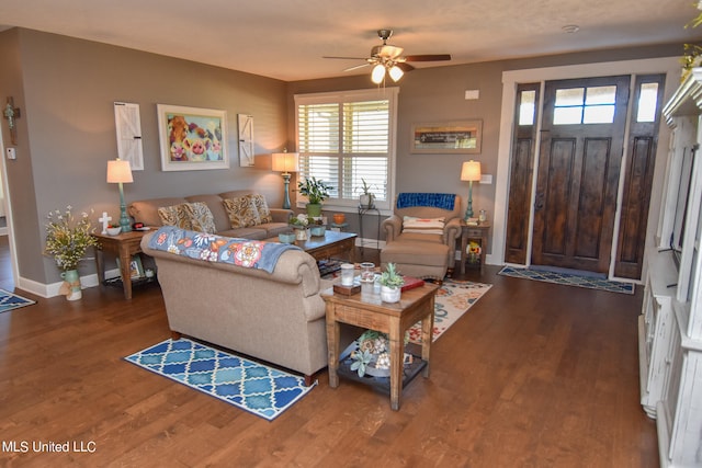 living room featuring wood-type flooring and ceiling fan