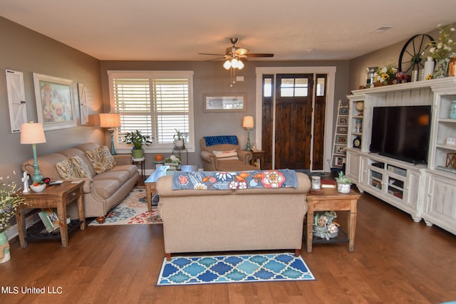 living room with ceiling fan, a healthy amount of sunlight, and dark hardwood / wood-style flooring