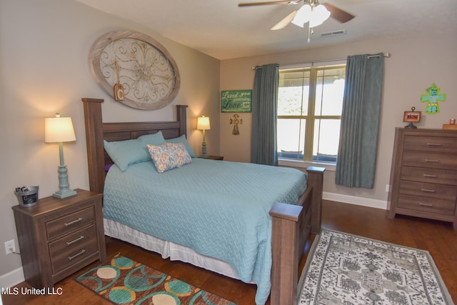 bedroom with dark wood-type flooring and ceiling fan