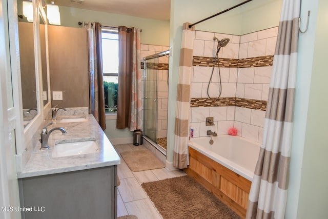 bathroom with vanity and independent shower and bath