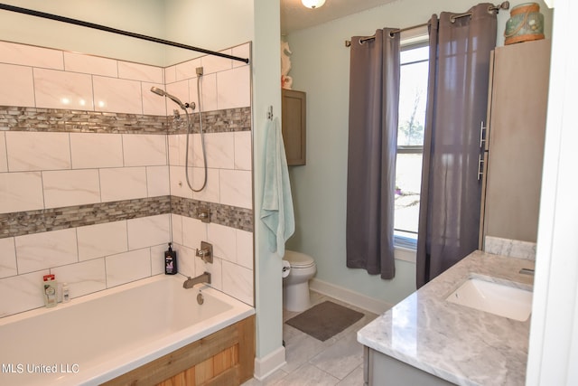 full bathroom featuring vanity, toilet, tile patterned floors, and tiled shower / bath