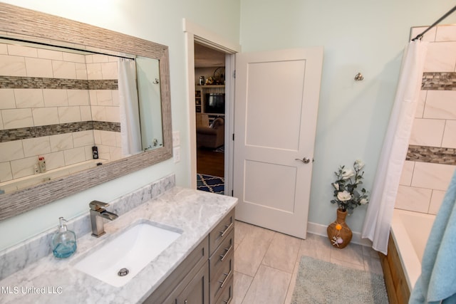 bathroom with vanity and shower / bath combination with curtain