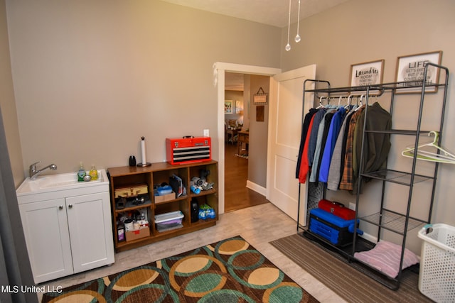 interior space with light hardwood / wood-style flooring and sink