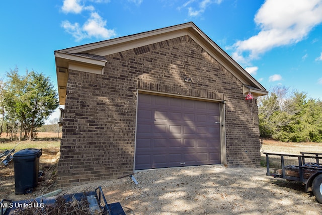 view of side of property featuring a garage