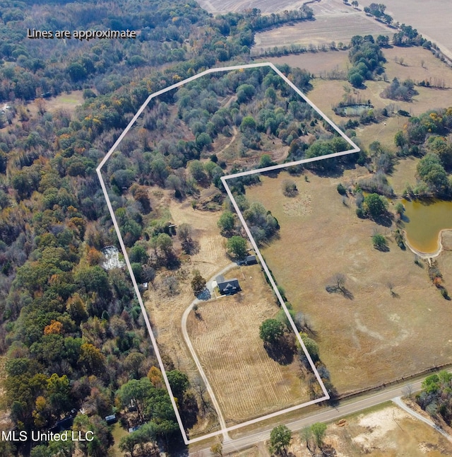 birds eye view of property with a water view and a rural view