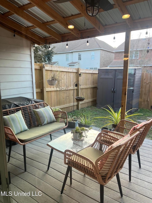 wooden terrace featuring an outdoor hangout area