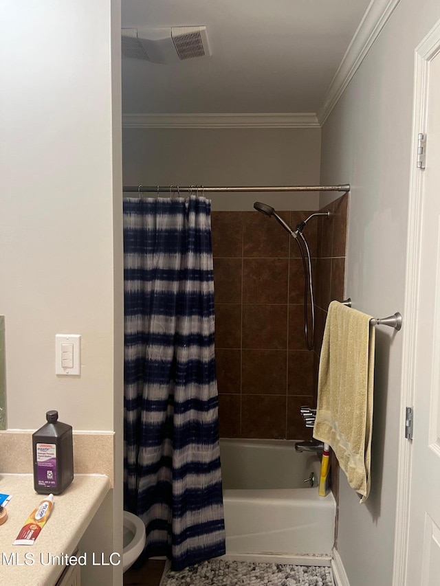 full bathroom featuring crown molding, vanity, toilet, and shower / bath combo