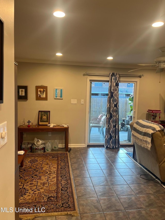 interior space featuring crown molding and ceiling fan