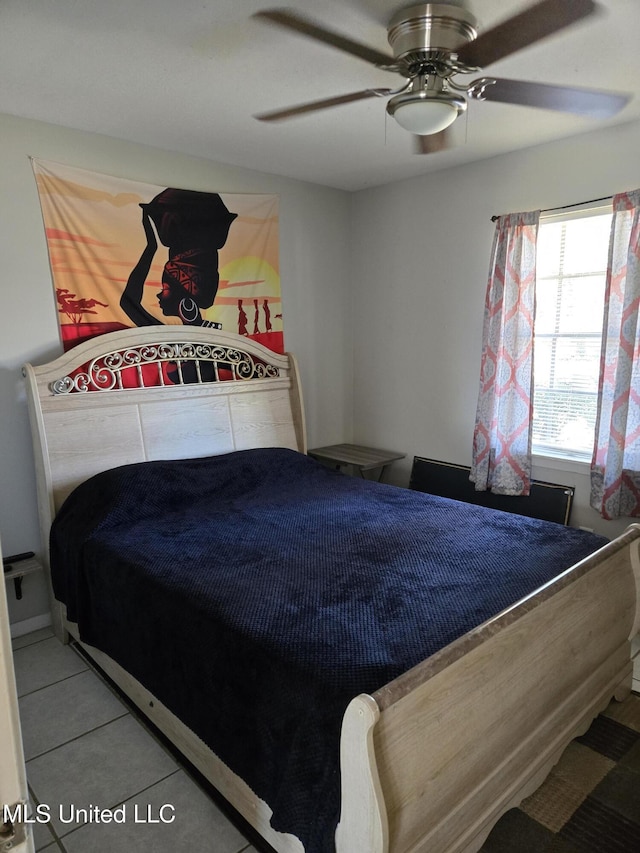 bedroom featuring a ceiling fan and light tile patterned floors