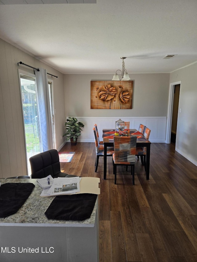 dining room featuring dark wood-style floors and visible vents