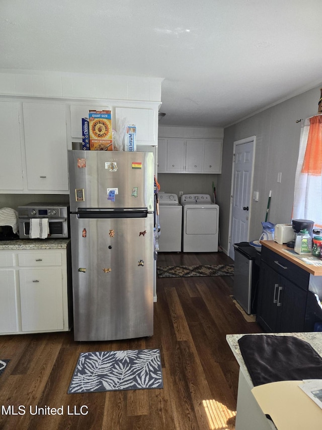 kitchen with white cabinetry, separate washer and dryer, light countertops, and freestanding refrigerator