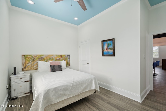 bedroom featuring dark hardwood / wood-style flooring and ceiling fan